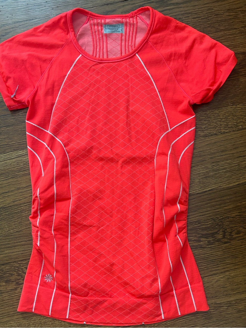 Athleta Finish Fast Line Tee in a bright neon tangerine  color